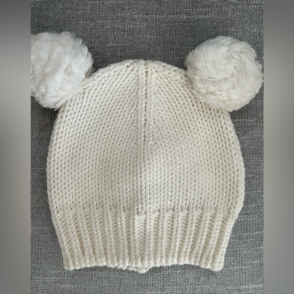 Cream/white baby winter hat with Pom Poms.